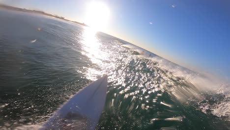 surfer man enjoying surfing doing a big snap in ocean on sunny day