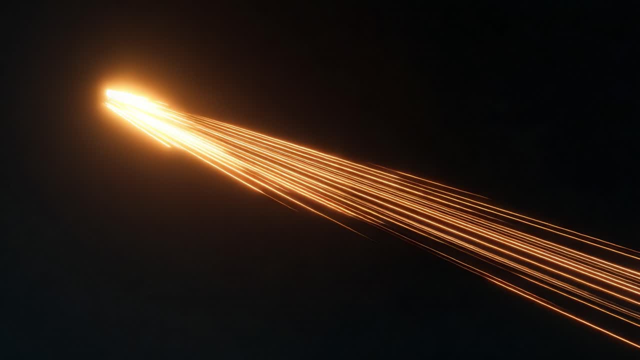Abstract animation showing a bright golden energy source flying across the screen, leaving a tail of glowing streaks behind it, symbolizing concepts like speed, data, and power