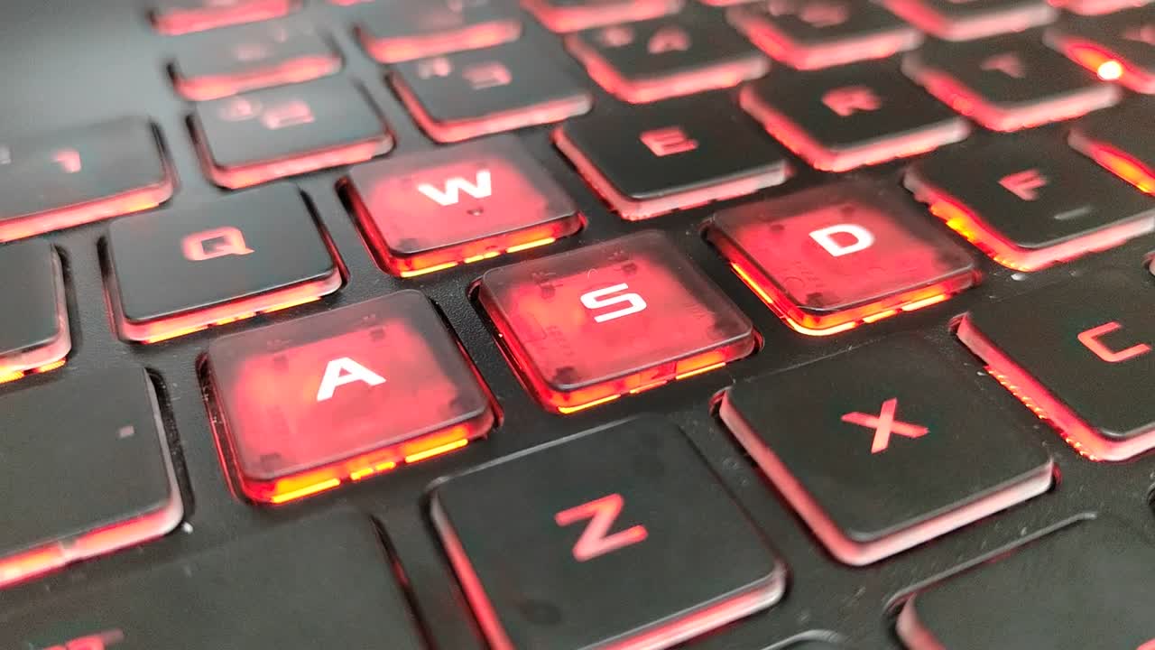 Red backlit gaming laptop keyboard. Perfect for high-performance gaming setups and intense sessions.