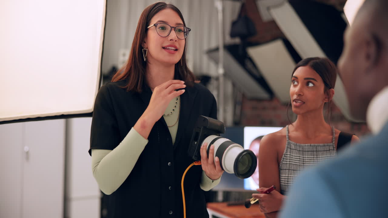Photographer working with models in a studio