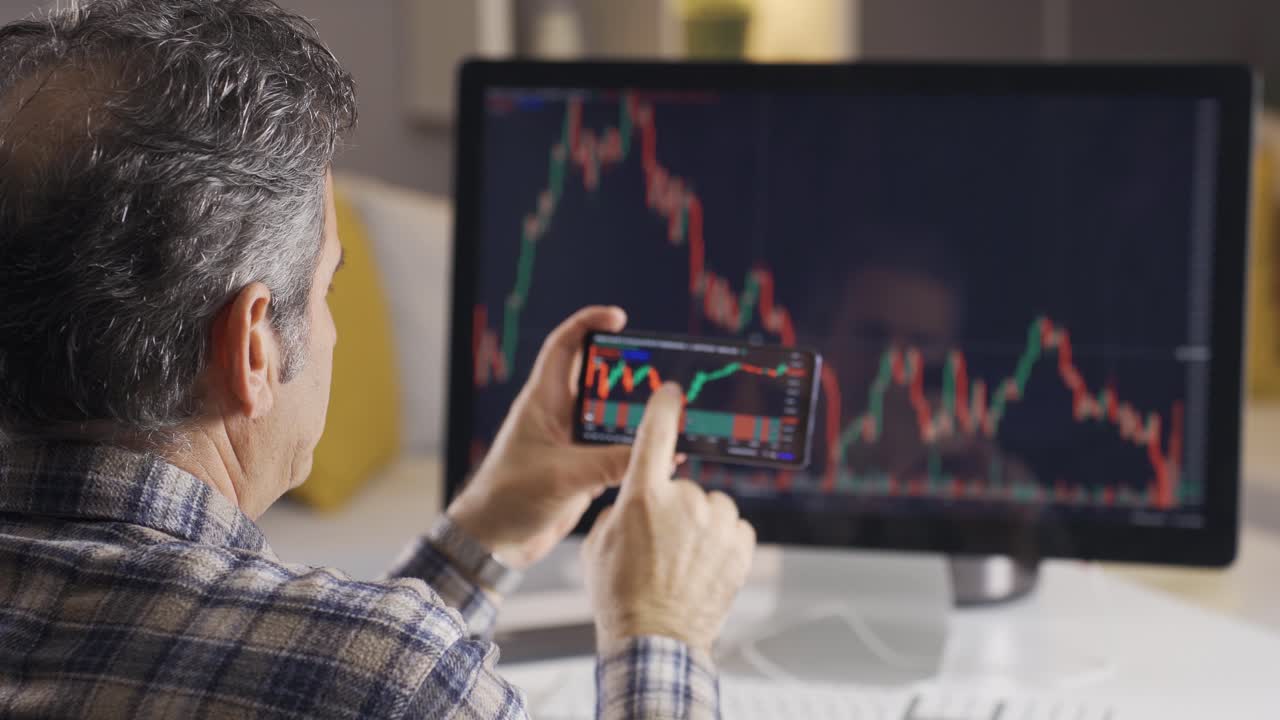 Man searching and analyzing stock market data.