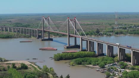 capturing an impressive cable stayed bridge crossing a tranquil river of justo jose de urquiza bridge over parana guazu river in argentina, built in the 70s by italian de miranda