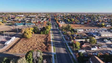 Greeley-Colorado-establishing-shot-road-follow-47th-avenue-full-fall-colors-line-the-road