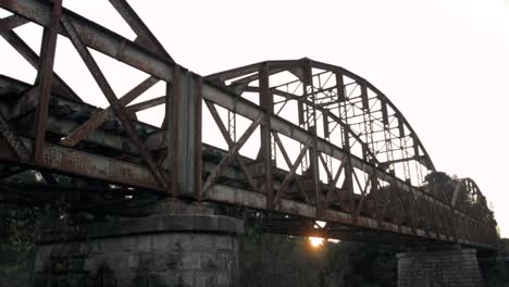 old metal bridge at sunset