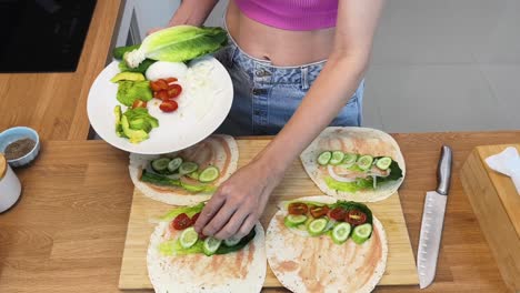 preparing healthy wraps with vegetables