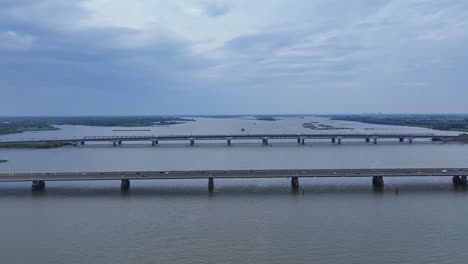 two bridges span the holland's deep river in the netherlands