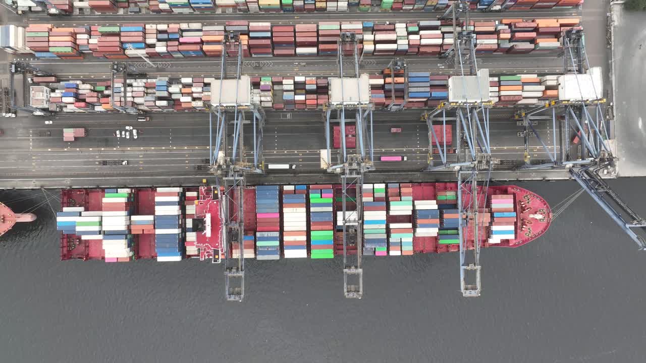 Aerial Birds Eye View Over Container Ship Docked At Karachi Port Trust Terminal