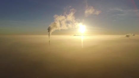 dense fog over city valmiera in early winter morning sunlight aerial footage wide shot