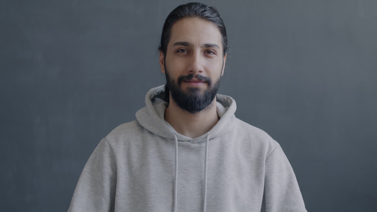 Man Smiling and Giving a Thumbs Up