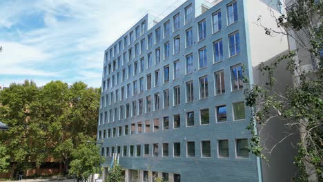 rising image of a modern building in lisbon,surrounded by trees, portugal