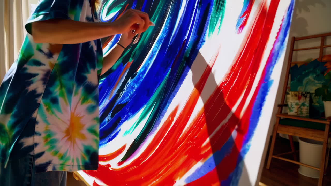 Woman painting abstract art in a home studio