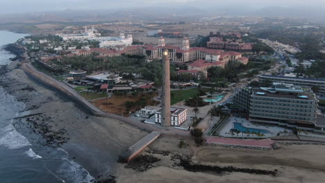 aerial orbit shot lighthouse of maspalomas in gran canaria, canary islands, spain