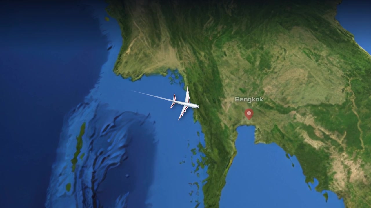 A commercial airplane flies across a satellite map from Mumbai, India to Bangkok, Thailand