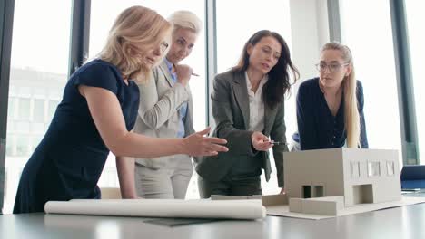 team of four female architects at work