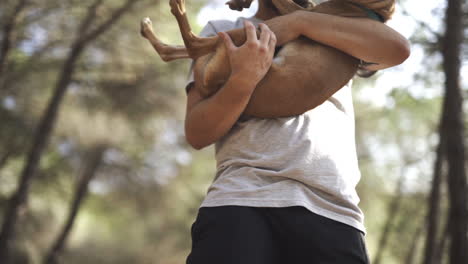 caressing baby indie pup hound with affection