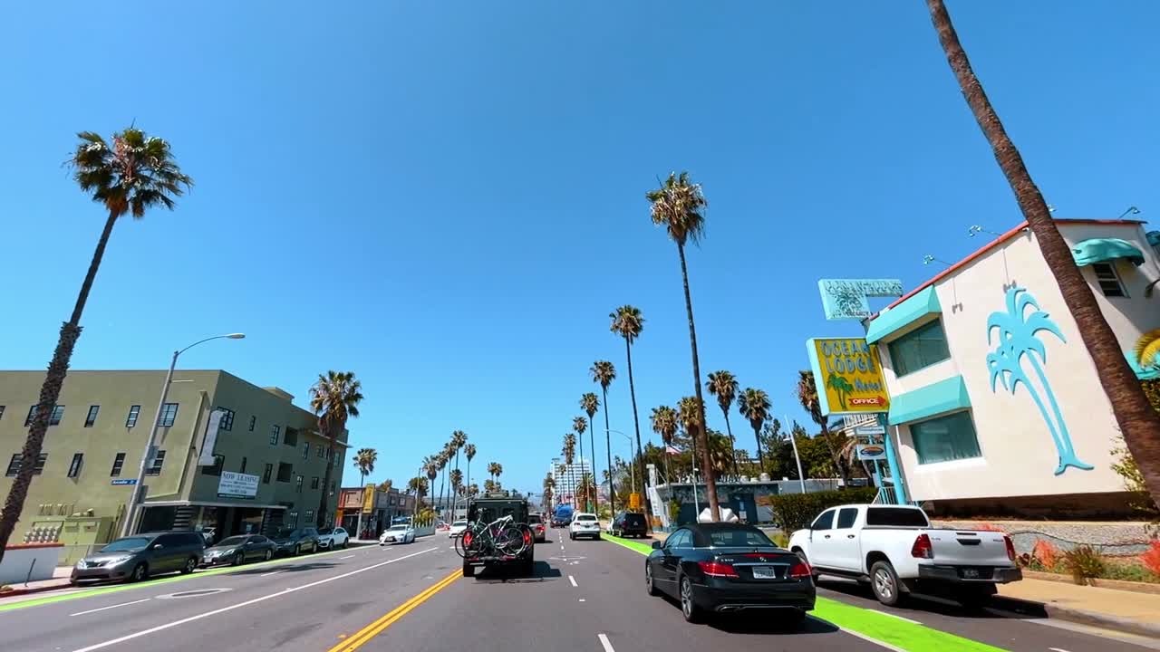 Santa Monica, USA, 14 August 2025: Urban street intersection with palm trees in Santa Monica California