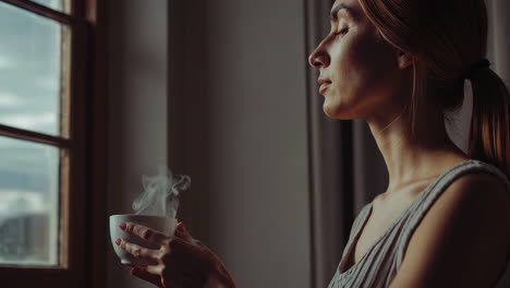 Woman Relaxing by the Window with a Cup