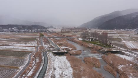 rural japan, slow forward flying push through fall snow