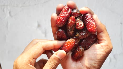 Hand-pick-a-date-fruit-top-view