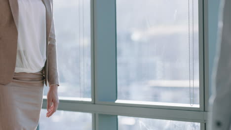business women shaking hands in boardroom successful corporate handshake for partnership deal welcoming opportunity for cooperation in office workplace 4k