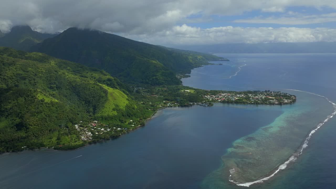 North Shore Vallee de Taitira Bay Tahiti French Polynesia aerial drone village town Teahupoo passe coral barrier reef Vaitepiha River Taravao Taiarapu South Pacific Ocean morning blue sky boat circle