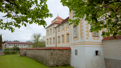 renaissance baroque palace in medieval european town, castle in slovenska bistrica, slovenia, exterior with defensive trench and stone walls