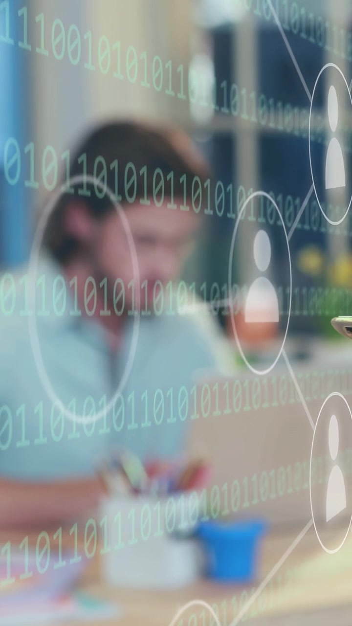 Vertical video: Man leaning, grabbing pen and writing as binary nodes animating around him in tech