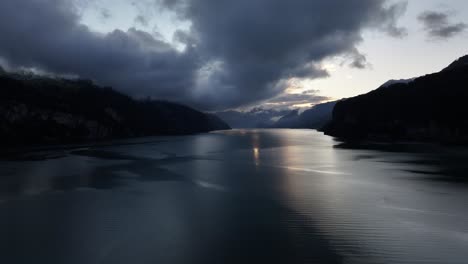 twilight over calm walensee moody sky and reflections amden switzerland