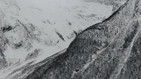 Dombay-snow-mountains-caverns-and-small-town-view-from-aerial