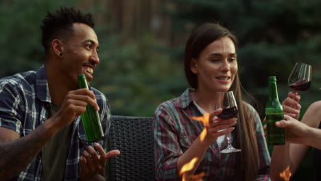 Happy-friends-telling-stories-in-backyard