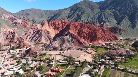 Soccer-field-at-the-foot-of-Cerro-de-los-Siete-Colores-in-Purmamarca,-Jujuy,-Argentina