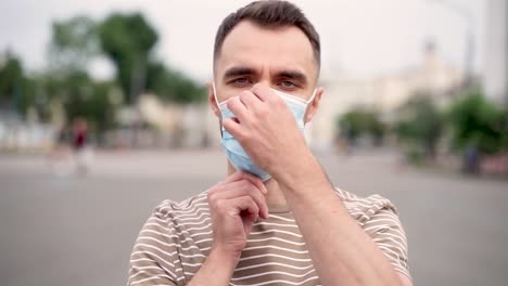 man putting on medical face mask