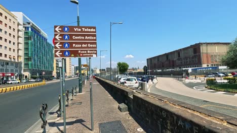 street scene with cars and directional signs