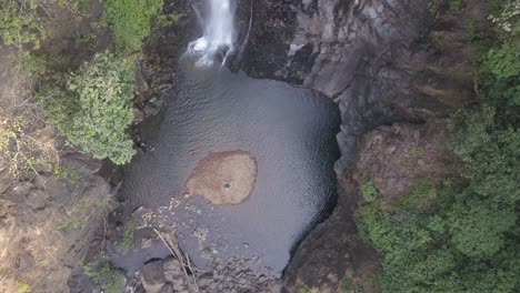 quiet lagoon at mainapi waterfall in netravali wildlife sanctuary in south goa, india