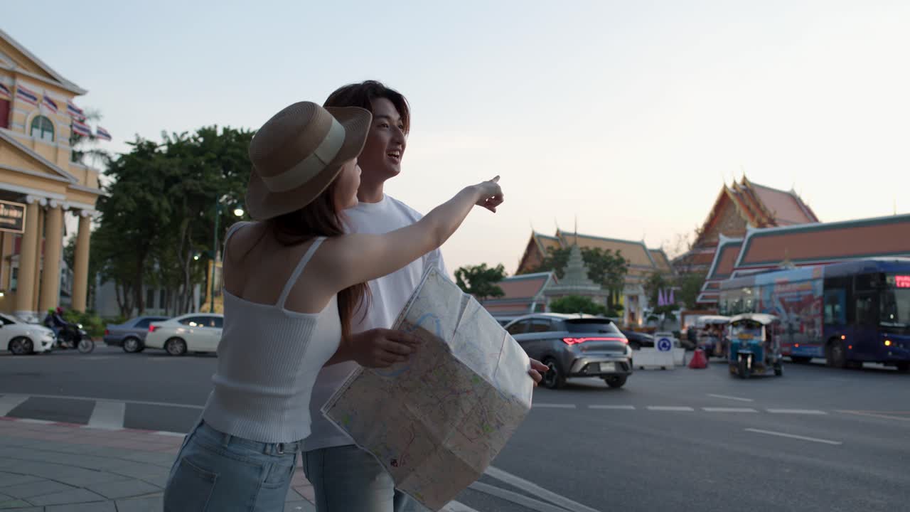 Couple using a map while traveling in the city
