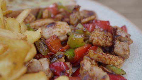 chicken and vegetable plate with fries