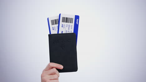 hand, passport and flight tickets for travel