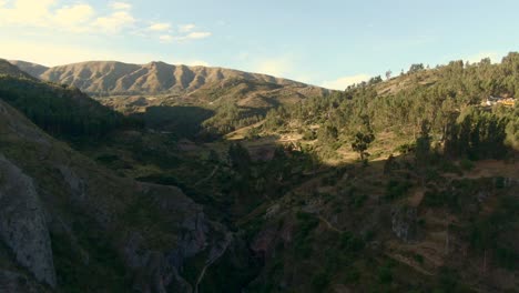 flight above tambomachay valley towards inkilltambo in cusco, peru