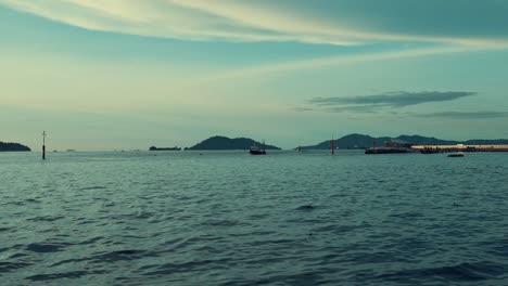 beautiful summer sunset at waterfront seafood night market sabah,boat,island,jetty and seafood eateries,kota kinabalu,malaysia.
