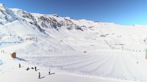 Truck-right-panoramic-view-of-the-snow-capped-Andes-mountains-in-Farellones-park-in-the-winter-season,-Chile