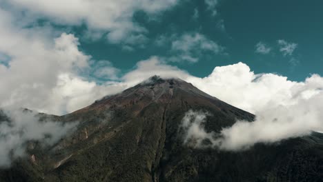 white clouds over tungurahua volcano in ecuador - aerial drone shot