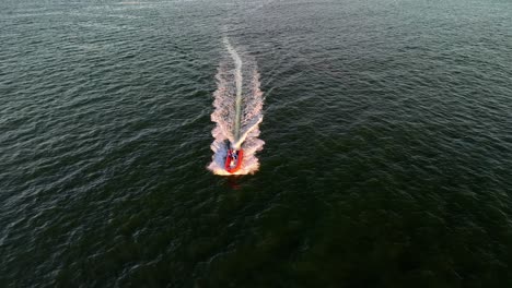 a boat cruising at high speed on the waters on maui, hi