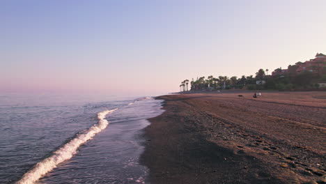 shoreline at a quiet beach in marbella, spain