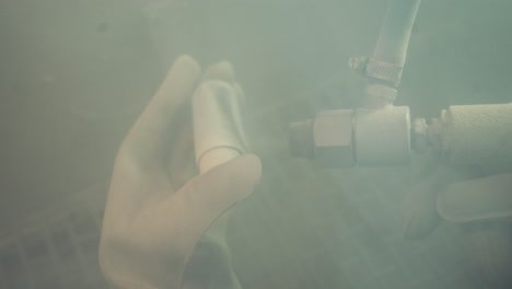 Industrial painting details. Close up view of worker painting powder painting and surface preparation