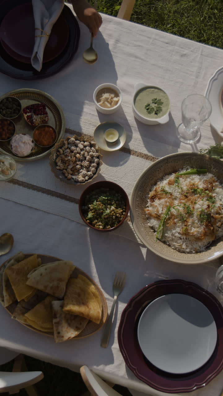 Outdoor dining experience featuring a variety of traditional Indian dishes