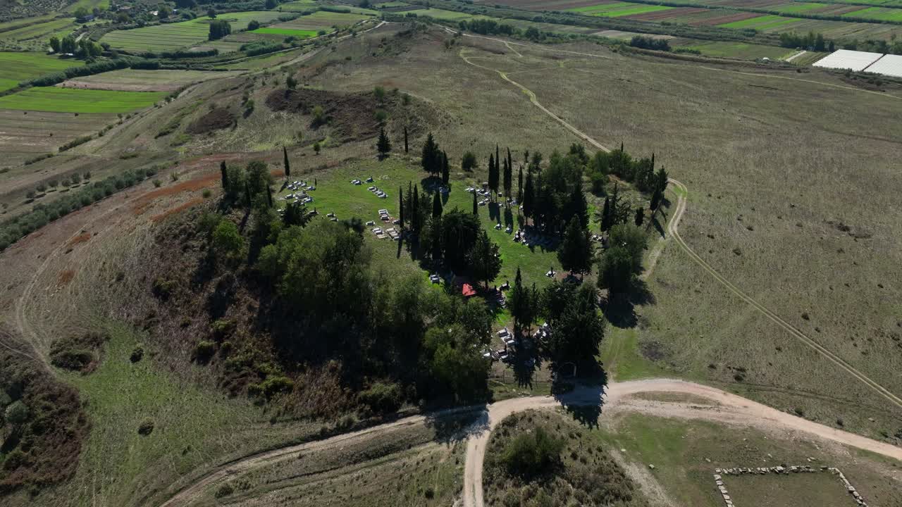 Aerial: Apollonia (Illyria) ruins, ancient Greek trade colony during the day in Fier County, Albania, orbit drone shot
