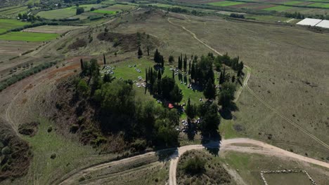 aerial: apollonia (illyria) ruins, ancient greek trade colony during the day in fier county, albania, orbit drone shot