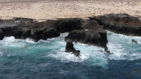 Fantastic-aerial-shot-over-the-coast-of-the-island-of-La-Graciosa-and-close-to-the-Caletones-arches