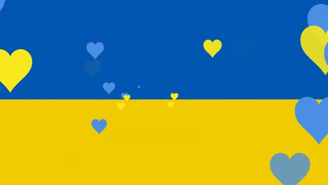 animation of blue and yellow hearts floating over flag of ukraine