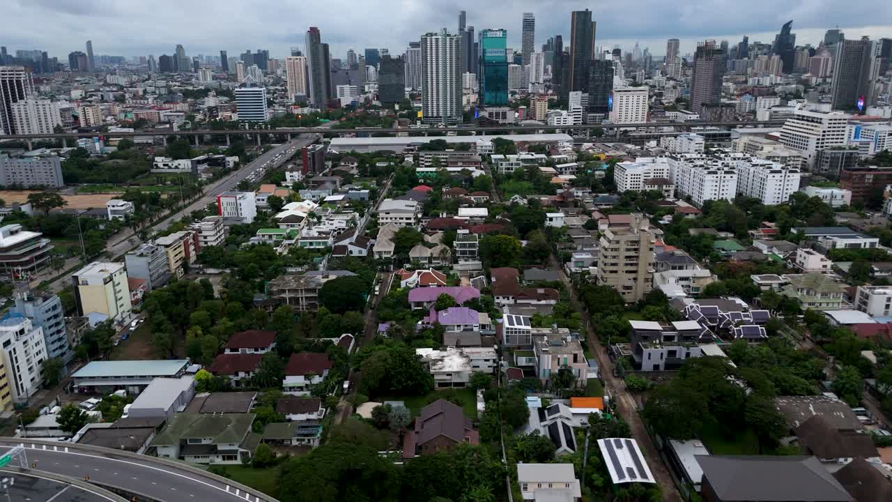 Bang Kapi district in Bangkok, dense residential area with houses and streets. Everyday urban life and modern architecture of Southeast Asian city